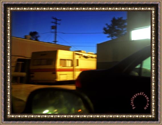 Raymond Gehman Trailer And Cars Parked Behind a Gas Station at Twilight Framed Painting