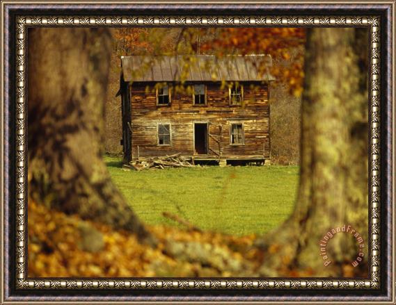 Raymond Gehman Weather Beaten Farmhouse Framed by Two Large Trees Framed Print