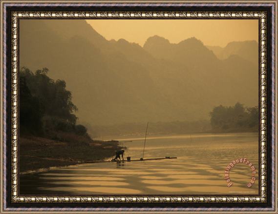 Raymond Gehman Woman Fishes Along The Mingjiang River at Sunset Framed Print
