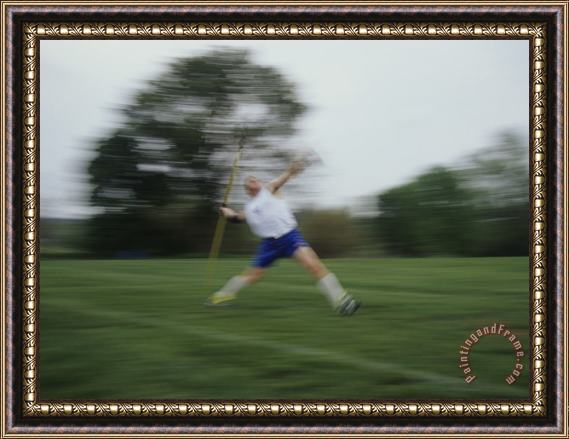 Raymond Gehman Young Man Tossing a Javelin During a High School Track Meet Framed Painting