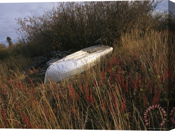 Raymond Gehman A Boat Rests Upside Down on The Shore of The Mackenzie River Stretched Canvas Painting / Canvas Art