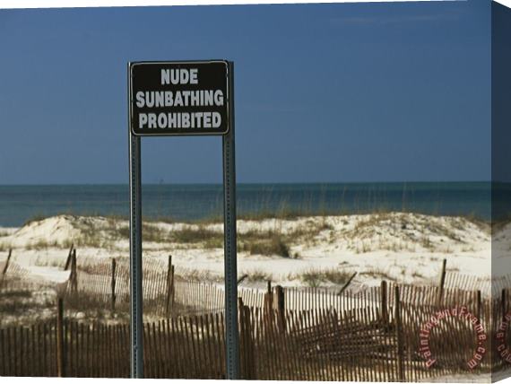 Raymond Gehman A Sign on a Public Beach Warns of No Nude Sunbathing Stretched Canvas Print / Canvas Art