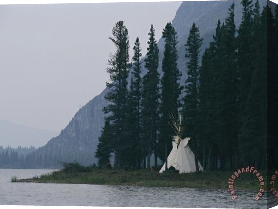 Raymond Gehman A Tepee Is Built on The Edge of Cli Lake Stretched Canvas Painting / Canvas Art