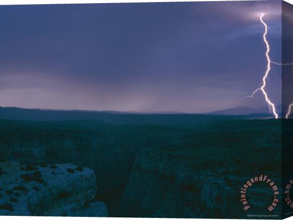 Raymond Gehman A View of a Lightning Strike Over Bighorn Canyon National Recreation Area Stretched Canvas Painting / Canvas Art