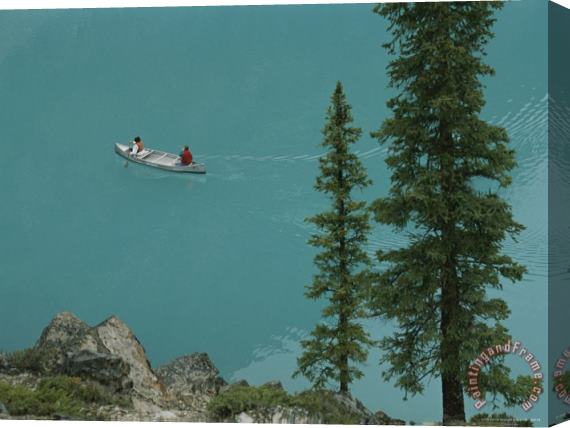 Raymond Gehman Canoeists on Moraine Lake Stretched Canvas Painting / Canvas Art