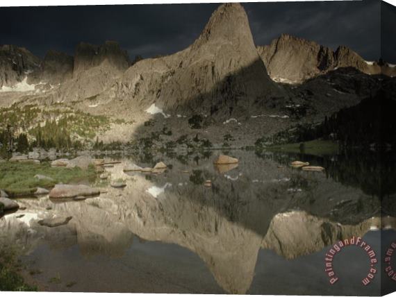Raymond Gehman Lonesome Lake Mirrors The Play of Light And Shadow on Pingora Peak in The Cirque of The Towers Stretched Canvas Print / Canvas Art