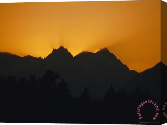 Raymond Gehman Mountain Peaks Appear in Silhouette at Twilight Stretched Canvas Painting / Canvas Art