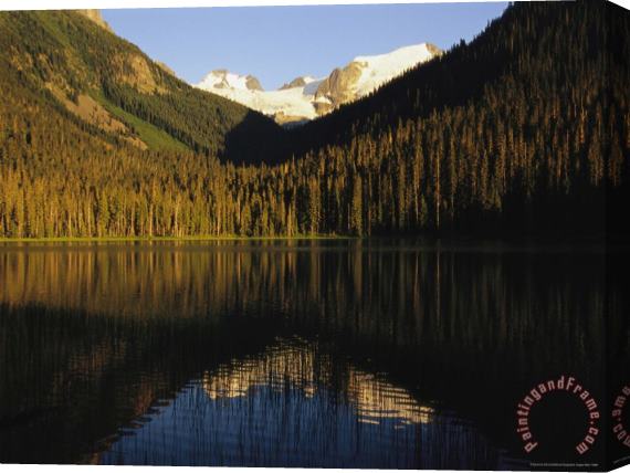 Raymond Gehman Snow Capped Mountains Reflect in a Lake Stretched Canvas Print / Canvas Art