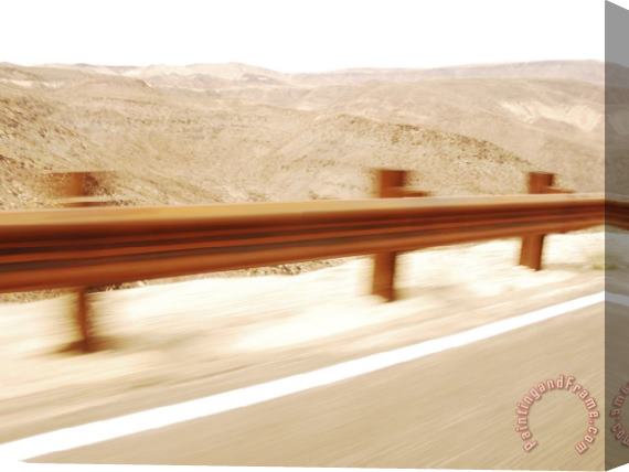 Raymond Gehman Speeding Past a Guard Rail Through Death Valley National Park Stretched Canvas Painting / Canvas Art