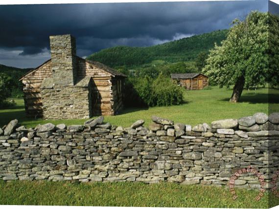 Raymond Gehman Storm Clouds Form Above Log Buildings on The Site of French Azilum Stretched Canvas Painting / Canvas Art