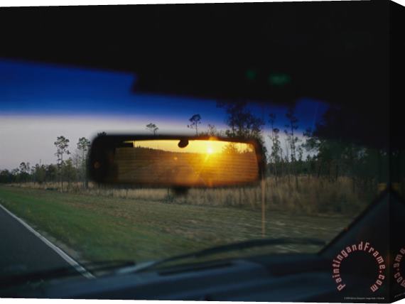 Raymond Gehman Sunrise Appears in a Drivers Rear View Mirror Stretched Canvas Print / Canvas Art