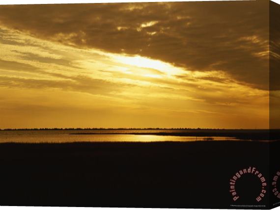 Raymond Gehman Sunset Over a Tidal Marsh with Cordgrass Stretched Canvas Print / Canvas Art