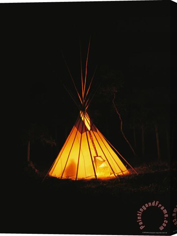 Raymond Gehman The Glow From a Campfire Makes a Shadow on a Tepee Stretched Canvas Print / Canvas Art