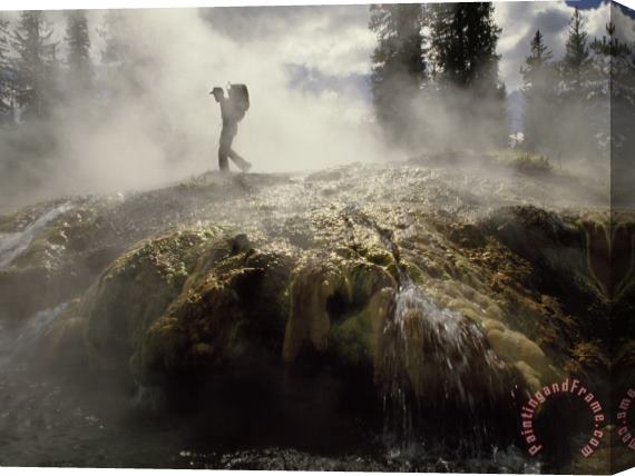 Raymond Gehman Venting Steam Veils a Hiker Skirting a Hot Spring in The Bechler Backcountry Stretched Canvas Painting / Canvas Art