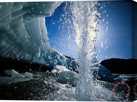 Raymond Gehman Water Splashes Over a Sheet of Ice on Wolf Creek Stretched Canvas Painting / Canvas Art