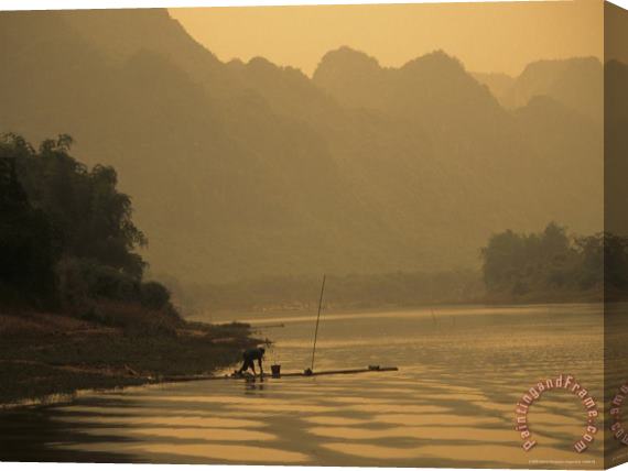 Raymond Gehman Woman Fishes Along The Mingjiang River at Sunset Stretched Canvas Painting / Canvas Art